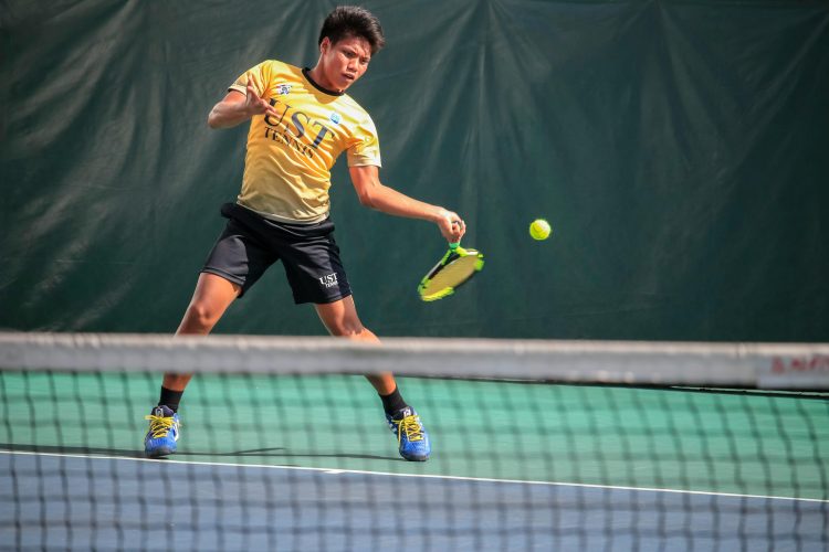 Image of man playing tennis